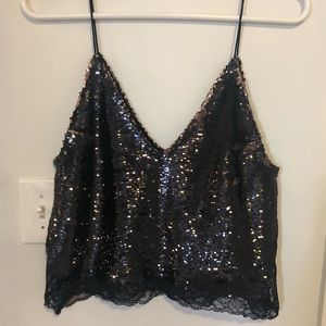 Free people sequin tank top with lace detail.